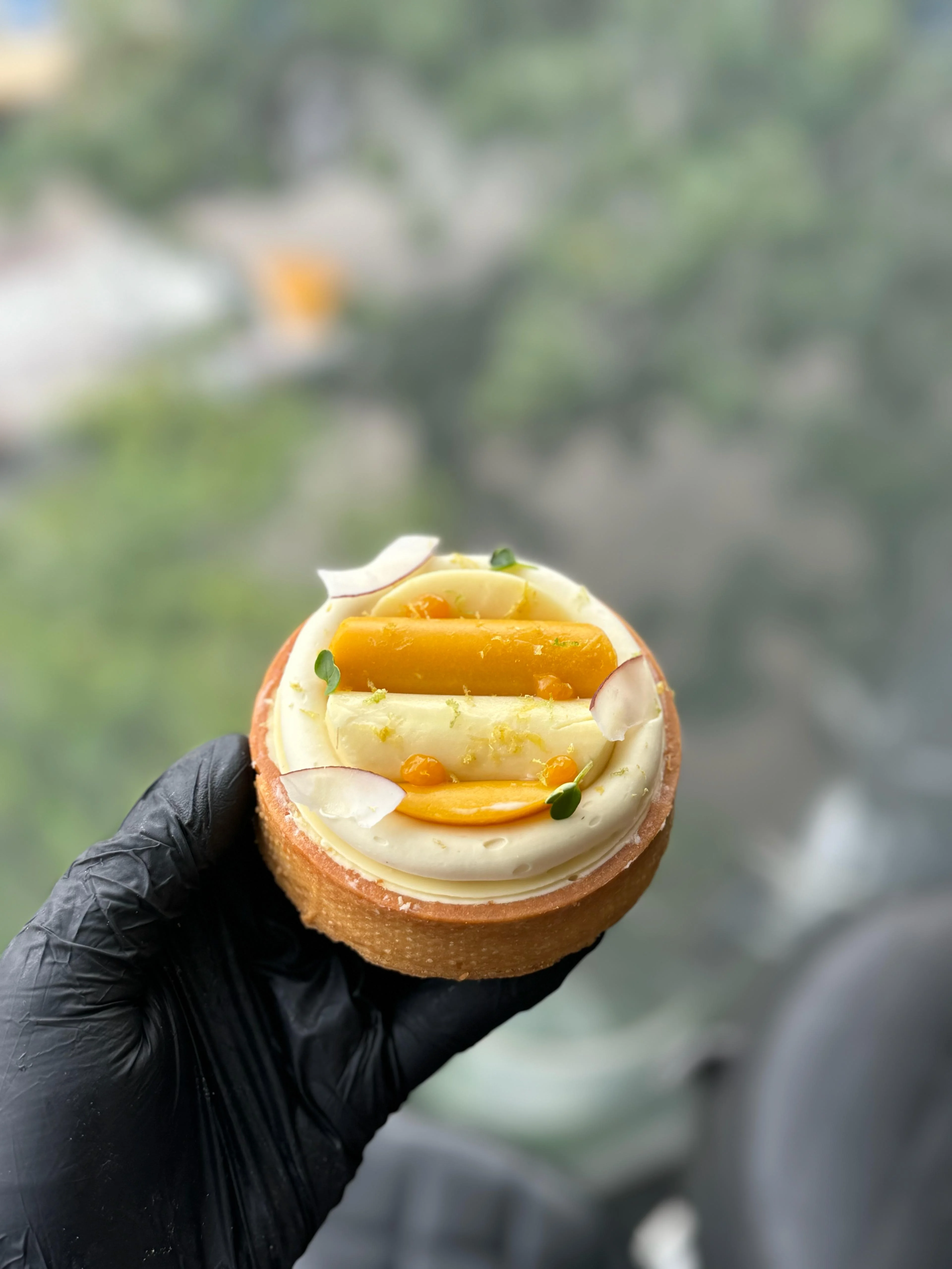 Mango & Coconut Tartelette — butter sablé with vanilla cream, mango batons, passion fruit pearls and lime zest